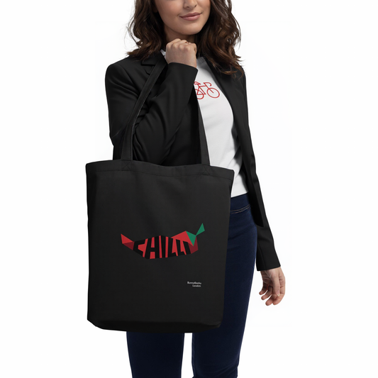 A model holding The Chilly Tote featuring a large red chili pepper and "Chilly" text on both sides.