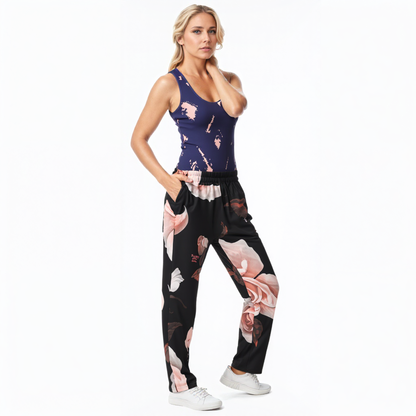 A BunnyBankY AI proprietary model wearing The Paris Flow Wide Joggers and Bristol Performance Tank. The image showcases the fluid, smooth floral print and the supportive fit, illustrating the brand's fusion of AI innovation and natural abstract design.