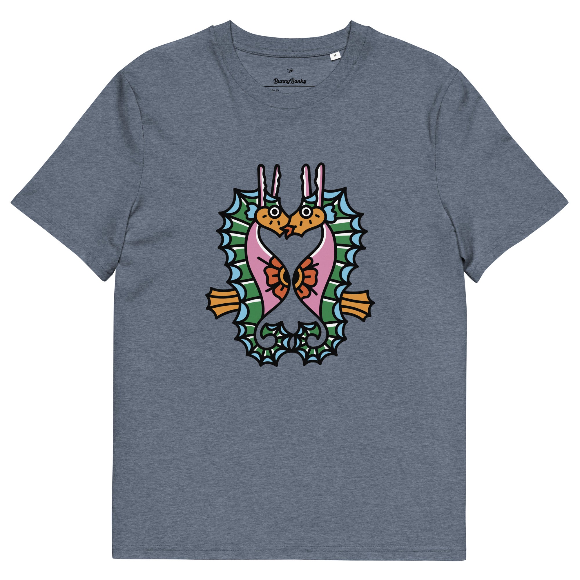 A_denim_blue_organic_t-shirt_featuring_a_symmetrical_graphic_of_two_colorful_seahorses_with_bunny_ears_and_floral_details.