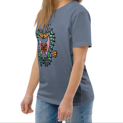 A denim blue organic t-shirt featuring a symmetrical graphic of two colorful seahorses with bunny ears and floral details.