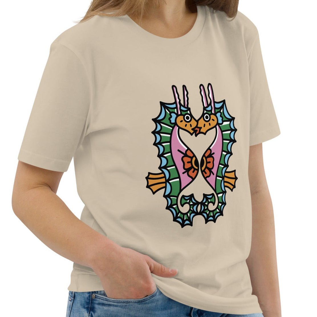 A dust beige organic t-shirt featuring a symmetrical graphic of two colorful seahorses with bunny ears and floral details.