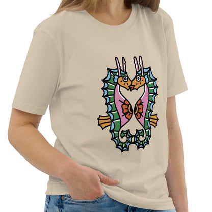 A dust beige organic t-shirt featuring a symmetrical graphic of two colorful seahorses with bunny ears and floral details.