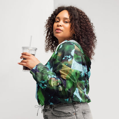 A model wearing The Abstract Crop Shell, showing the high-fashion, cropped silhouette and the abstract expressionism print in green and blue hues.