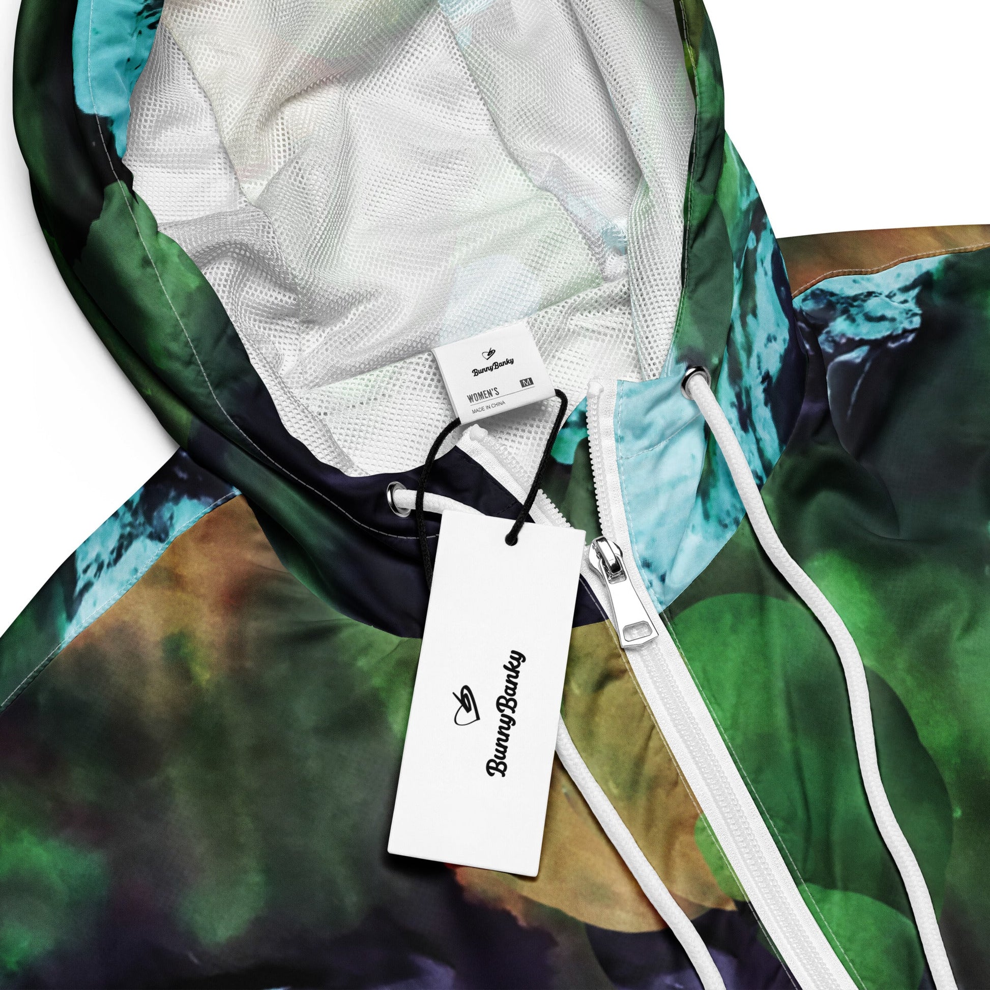 A close-up of The Abstract Crop Shell's fabric, highlighting the texture and the fluid, painterly abstract expressionism print.