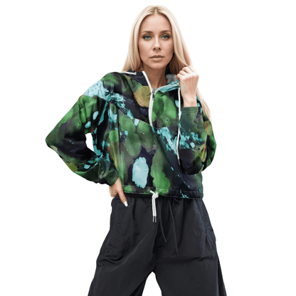 A model wearing The Abstract Crop Shell, showing the high-fashion, cropped silhouette and the abstract expressionism print in green and blue hues.
