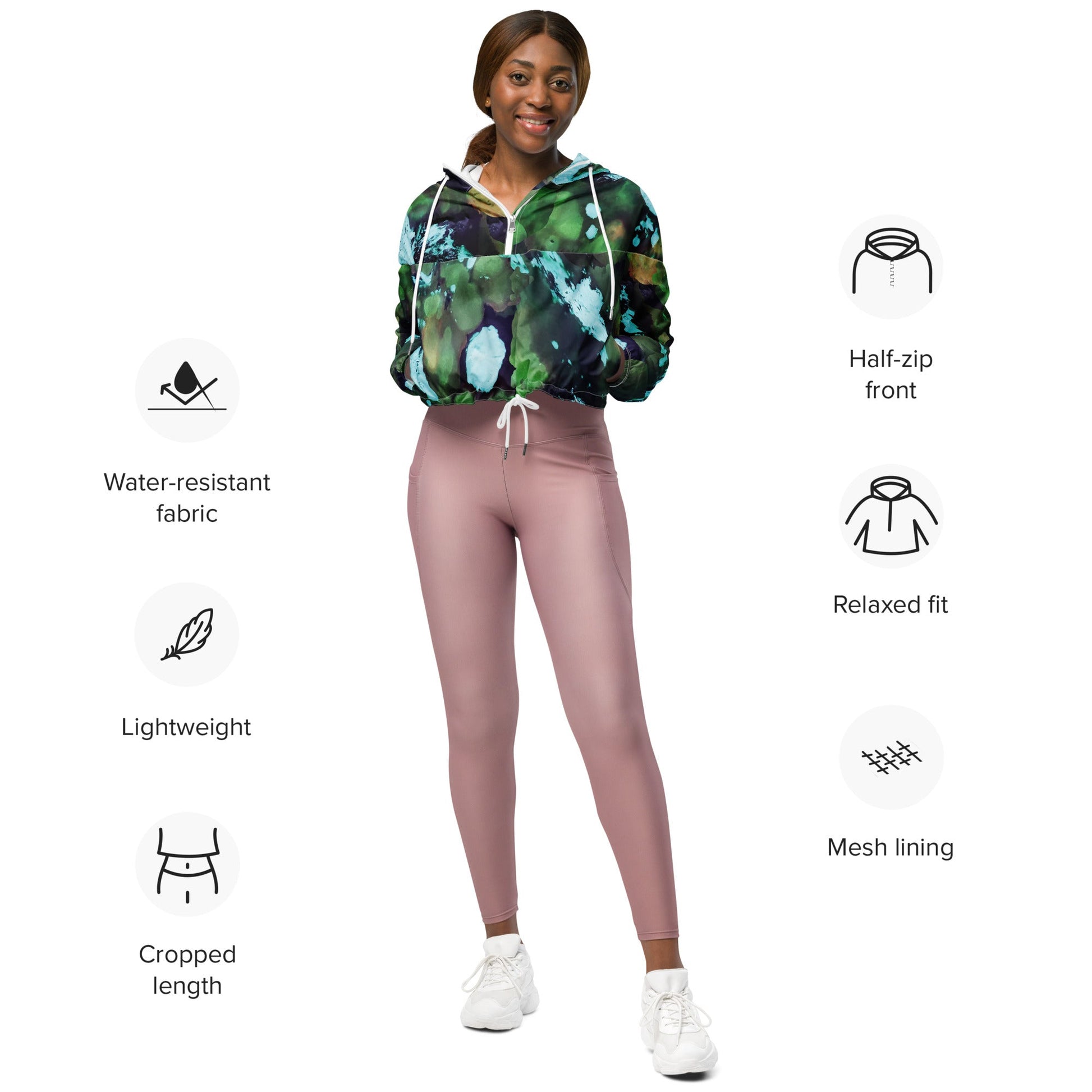 A model wearing The Abstract Crop Shell, showing the high-fashion, cropped silhouette and the abstract expressionism print in green and blue hues.