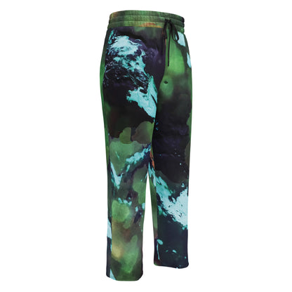 A close-up of The Abstract Flow Joggers' print, showing the soft recycled polyester fabric and the abstract expressionism brush strokes in green and blue.