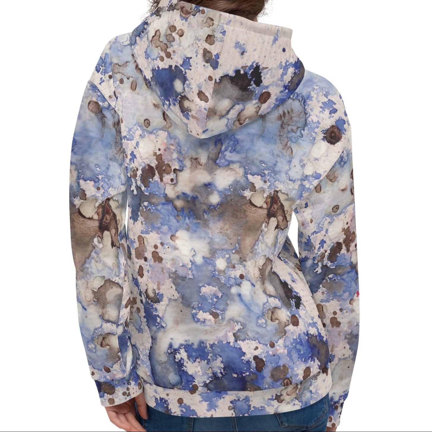 A  model wearing the Amalfi Resort Hoodie. The image showcases the fluid light blue, beige, and brown 