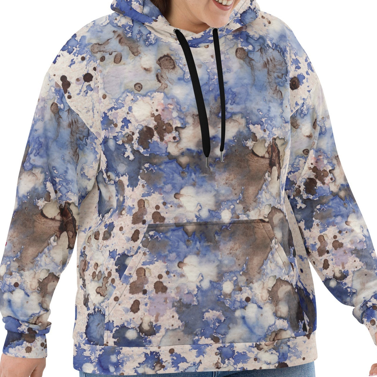 A  model wearing the Amalfi Resort Hoodie. The image showcases the fluid light blue, beige, and brown 