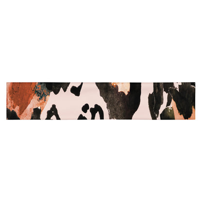 Close-up of the Amazonia headband showing the moisture-wicking fabric and vibrant animal print pattern