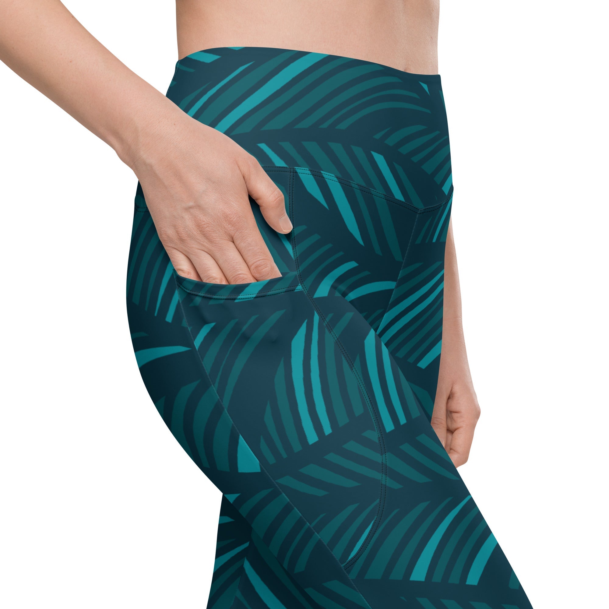 A model wearing The Amazonia Sculpt Leggings, showing the sculpting fit and the smooth dark green curved line print.