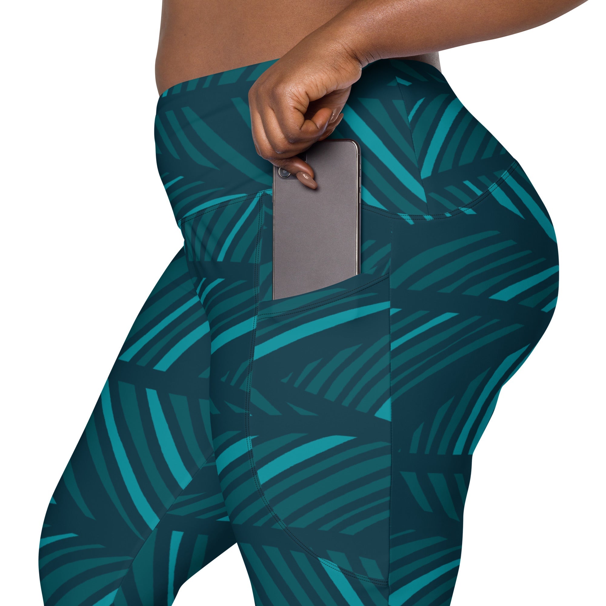 A model wearing The Amazonia Sculpt Leggings, showing the sculpting fit and the smooth dark green curved line print.