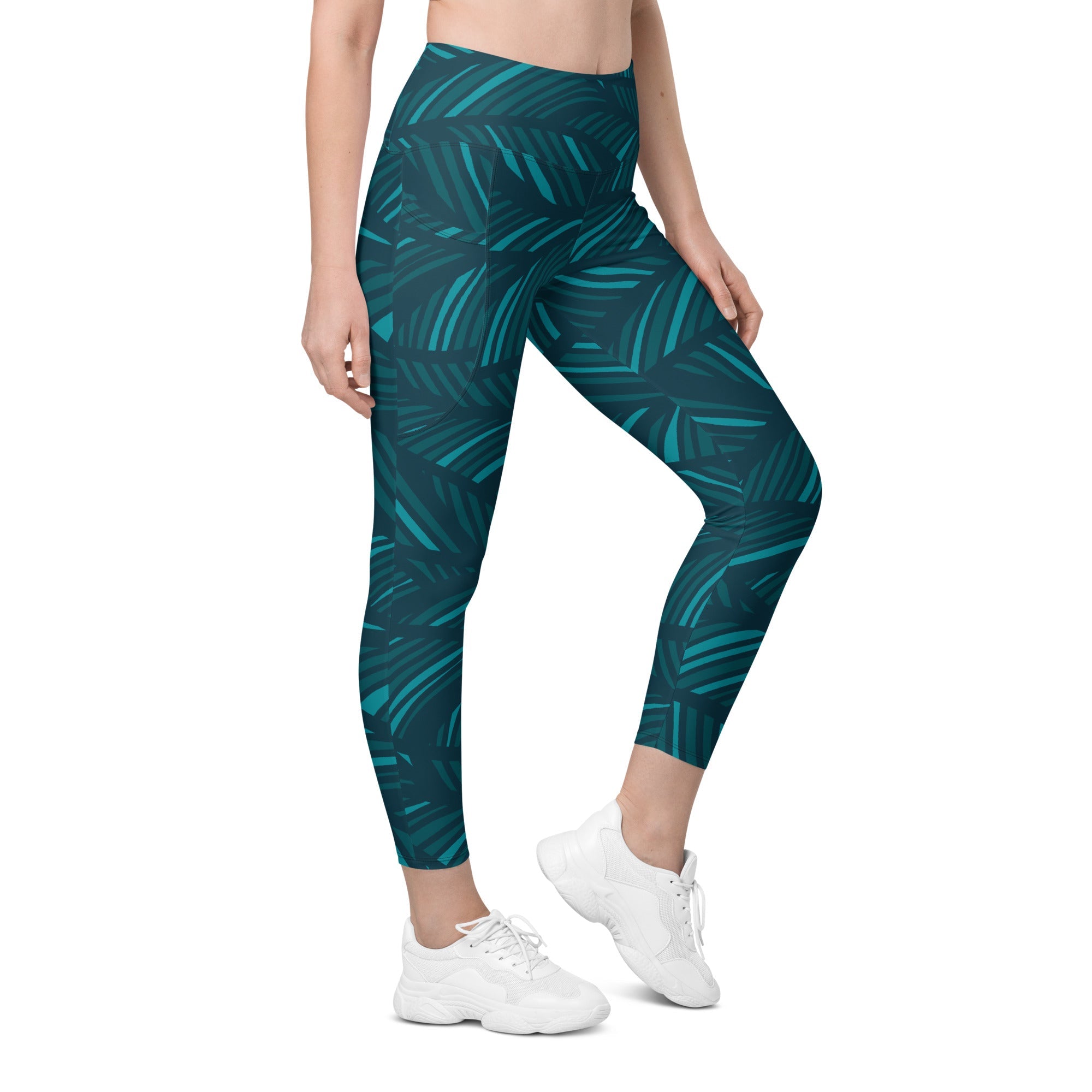 A model wearing The Amazonia Sculpt Leggings, showing the sculpting fit and the smooth dark green curved line print.