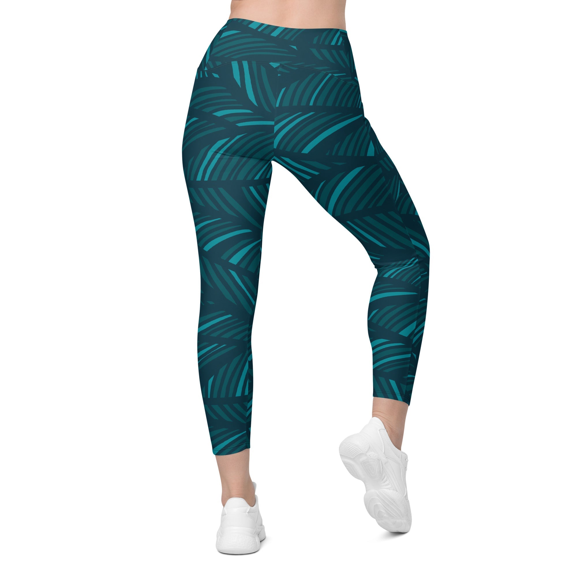 A model wearing The Amazonia Sculpt Leggings, showing the sculpting fit and the smooth dark green curved line print.