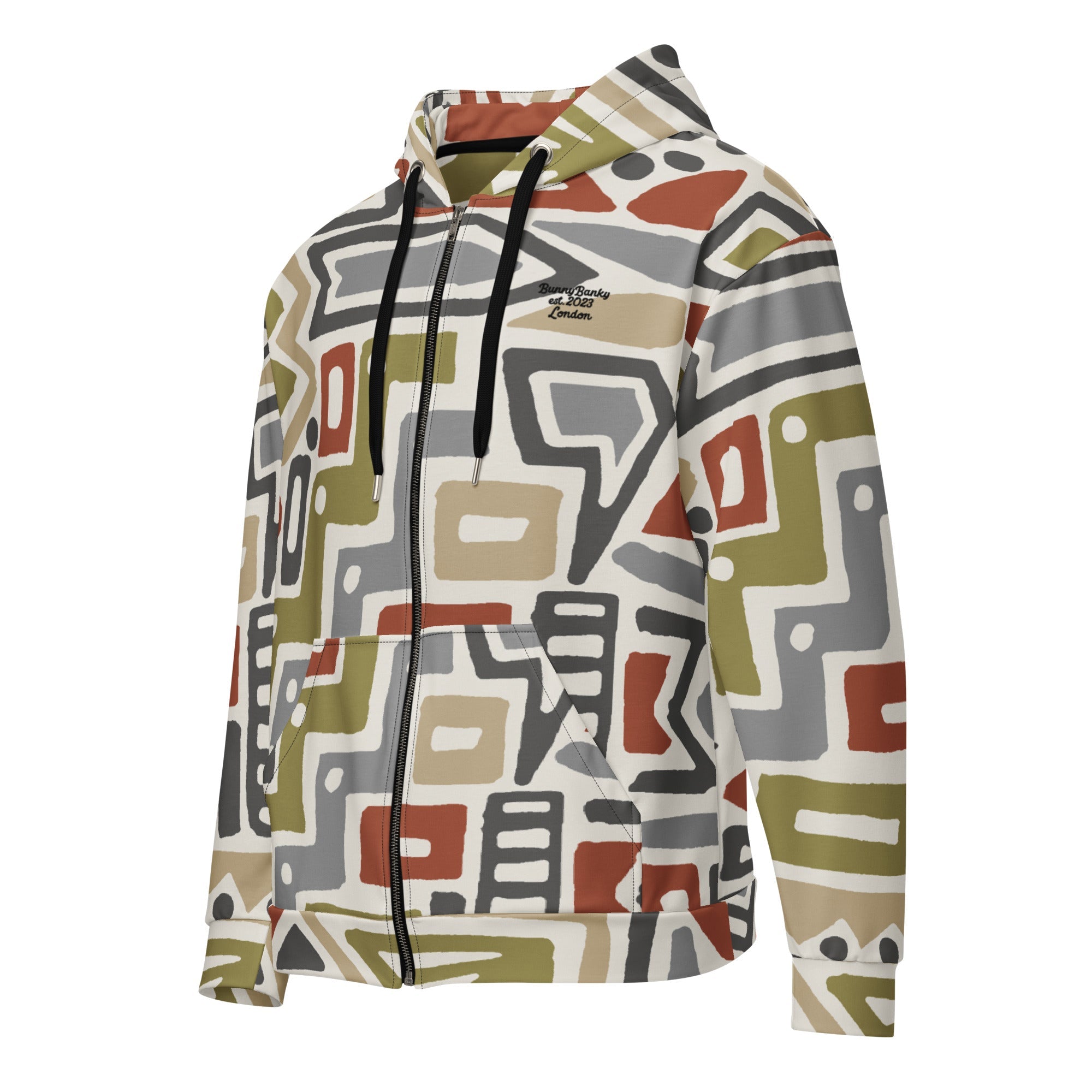 Close-up of The Amsterdam Zip Hoodie fabric, highlighting the textured, earthy tones of the geometric pattern and the soft feel of the 95% recycled polyester.