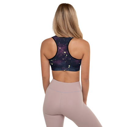 A model wearing The Andromeda Performance Bra, showing the supportive fit, and  the dark purple/black gradient fabric.