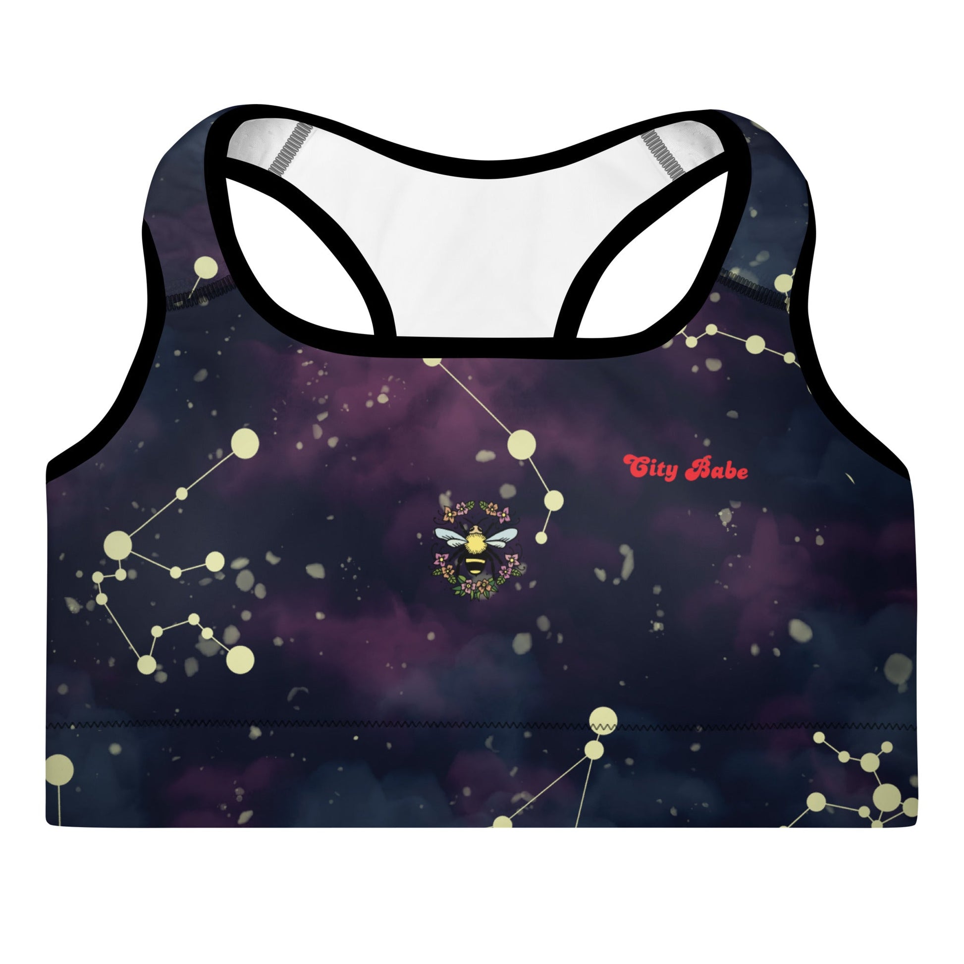 A close-up of The Andromeda Performance Bra's prints, showing the small bee, floral circle, and the "City Babe" text printed.