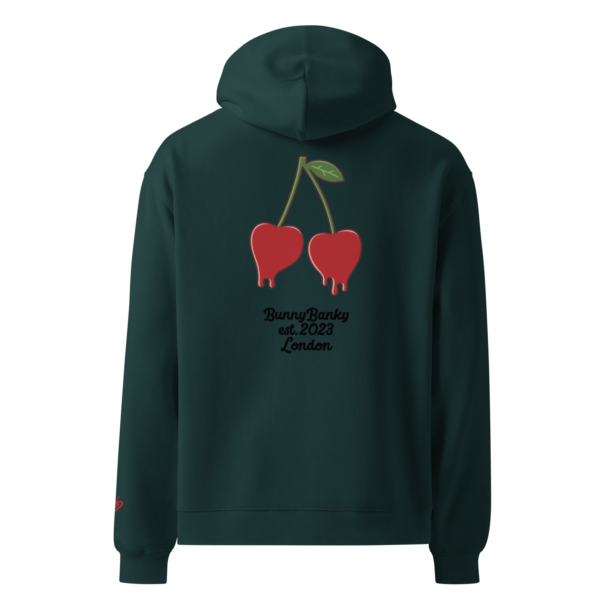 A close-up of the back of The Angel Wellness Hoodie, featuring the playful, pop-art cherry print and the heritage signature on the sleeve.
