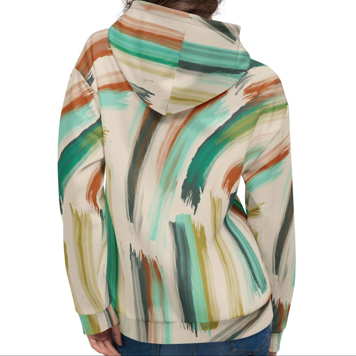 A model wearing The Artful Aura Hoodie, showing the relaxed, oversized fit and the soft pastel green brushstroke print on a beige background.
