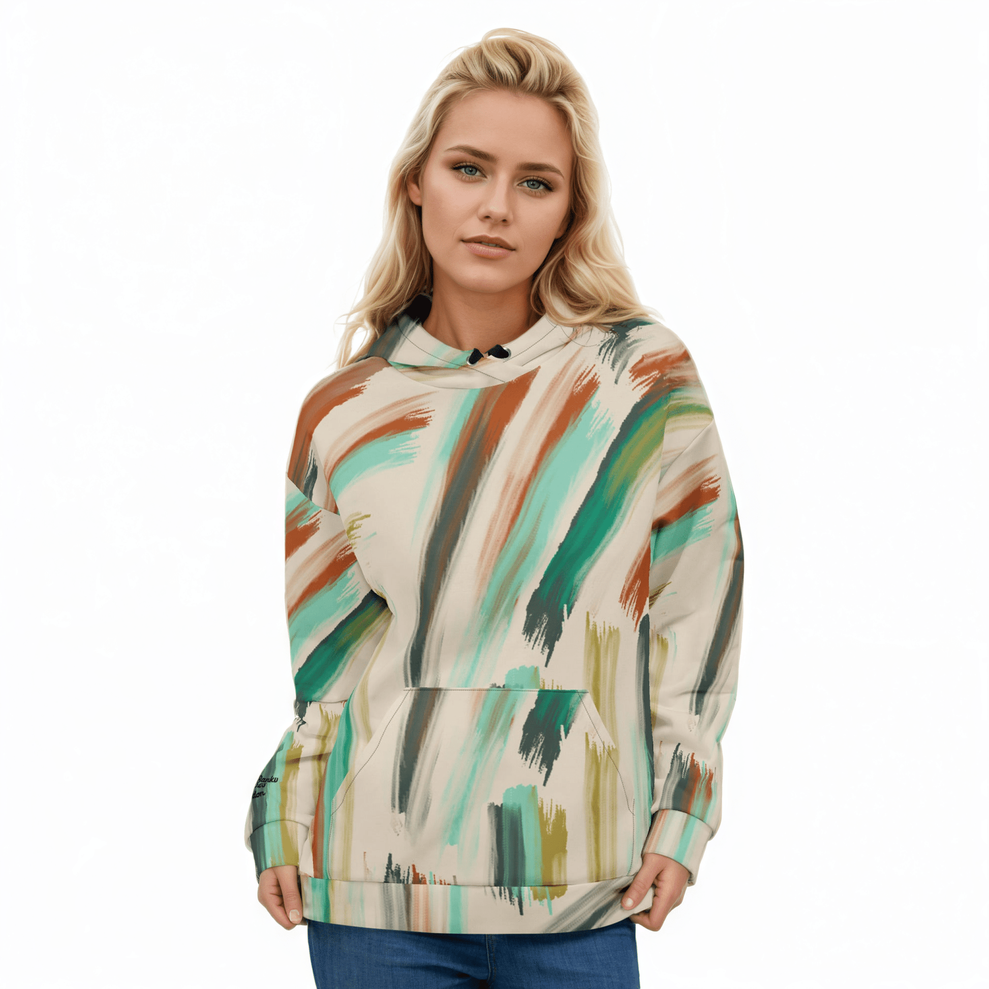 A model wearing The Artful Aura Hoodie, showing the relaxed, oversized fit and the soft pastel green brushstroke print on a beige background.