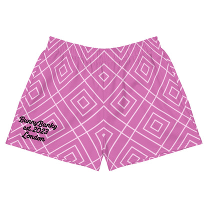 A close up of the Bahamas Athletic Shorts, featuring an elaborate pink and white geometric lattice print.