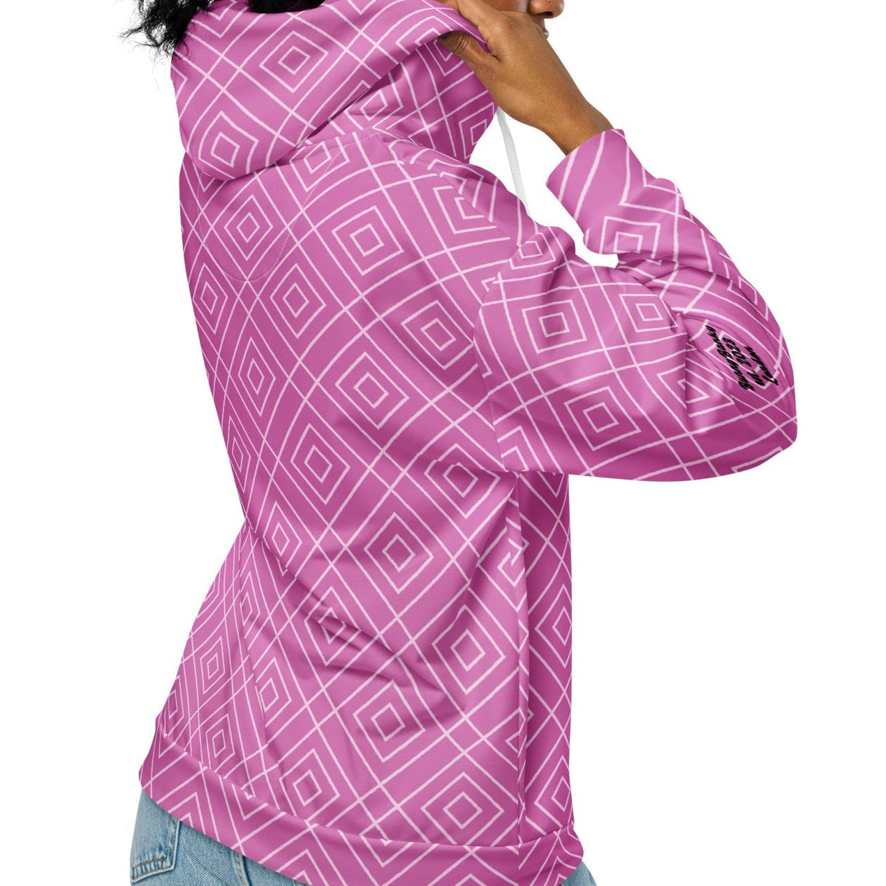 model wearing the Bahamas Zip Hoodie, showcasing the elaborate white diamond lattice print on a vibrant pink background.