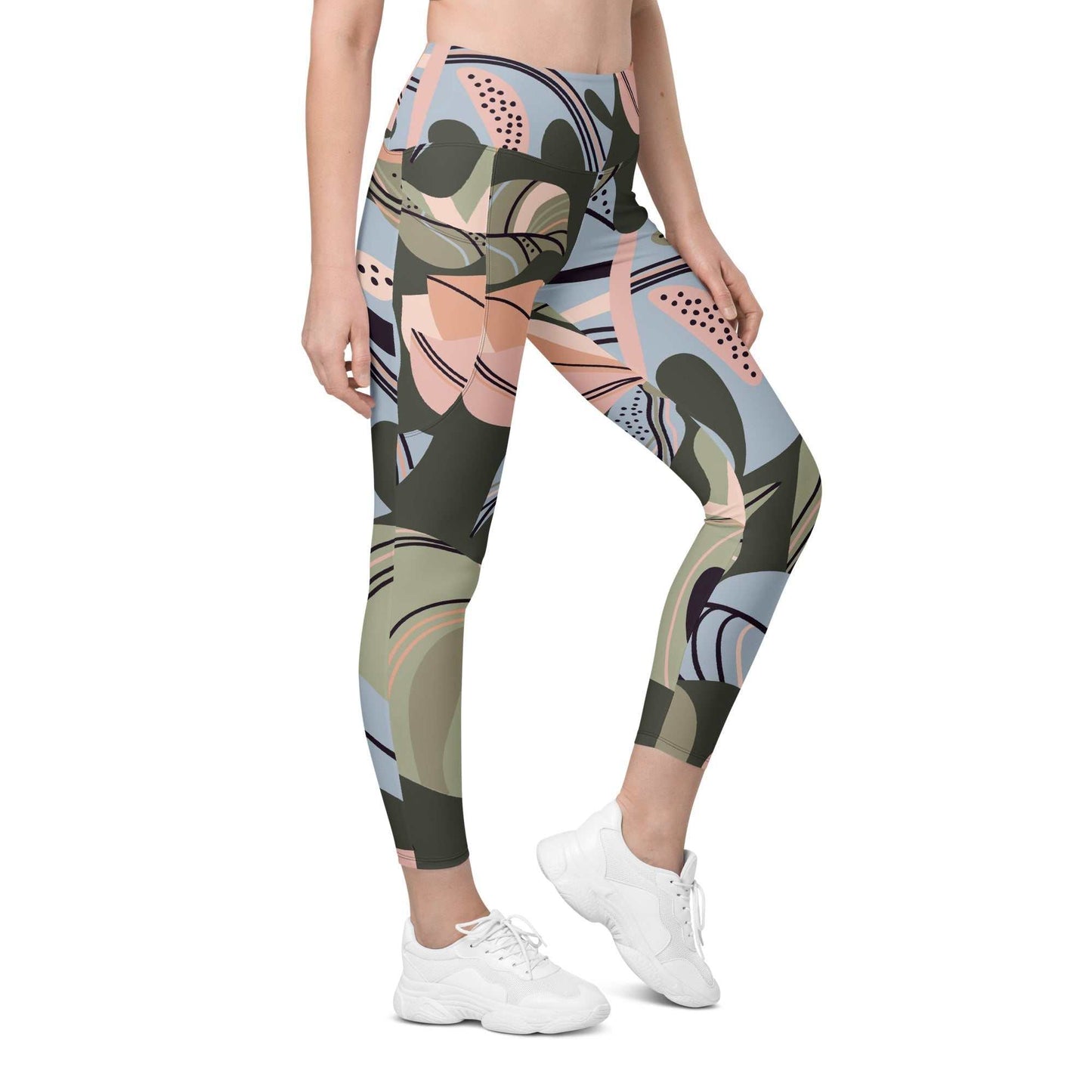 A model wearing The Barbican Sculpt Leggings, showing the sculpting fit and the pastel green and pink exotic flower print.