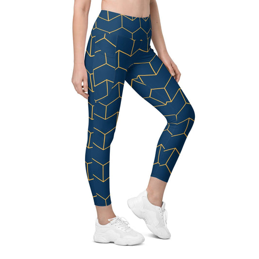 A model wearing The Barons Court Sculpt Leggings showing the matching navy and yellow Art Deco print.