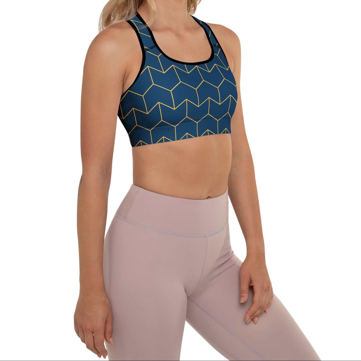 A model wearing The Barons Court Performance Bra, showing the supportive fit and the signature navy blue and yellow Art Deco print.