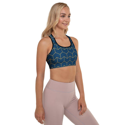 A model wearing The Barons Court Performance Bra, showing the supportive fit and the signature navy blue and yellow Art Deco print.