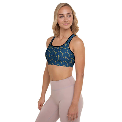 A model wearing The Barons Court Performance Bra, showing the supportive fit and the signature navy blue and yellow Art Deco print.