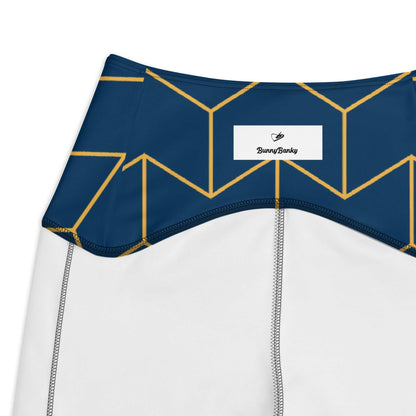 A close up of  The Barons Court Sculpt Leggings showing the matching navy and yellow Art Deco print.