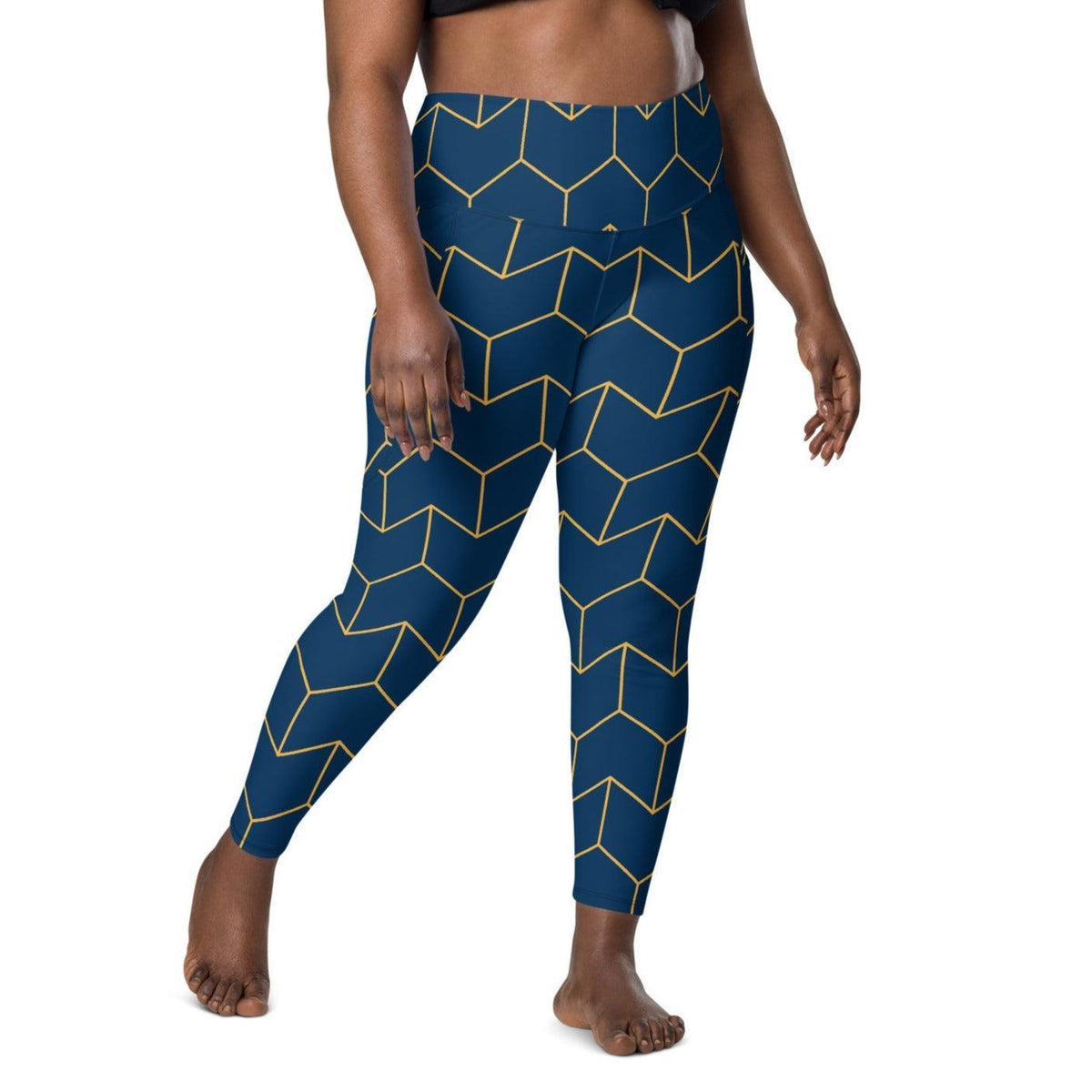 A model wearing The Barons Court Sculpt Leggings showing the matching navy and yellow Art Deco print.