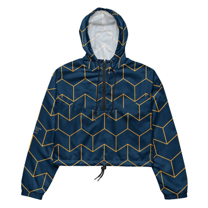 A close-up of The Baron's Court Windbreaker's navy blue and yellow Art Deco print, showing the recycled technical fabric, zip, and quality stitching.