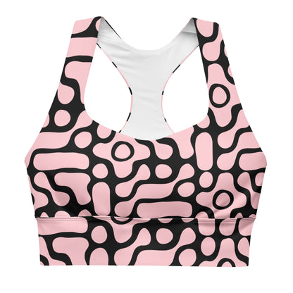 the Berlin Performance Bra in black geometric floral pattern on pink background