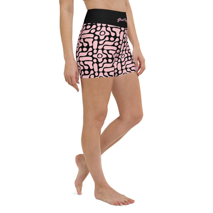 A close-up front view of BunnyBanky performance shorts featuring a bold, custom-designed geometric black floral pattern on a soft pink base. The high-waisted black compression waistband prominently displays the text "GOAL DIGGER" in a stylised, matching pink font. The shorts are designed for a snug, performance fit, shown here as part of a coordinated athletic set against a solid pink studio background.
