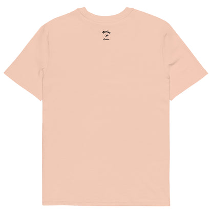Peach coloured t-shirt with a small logo on the back against a white background