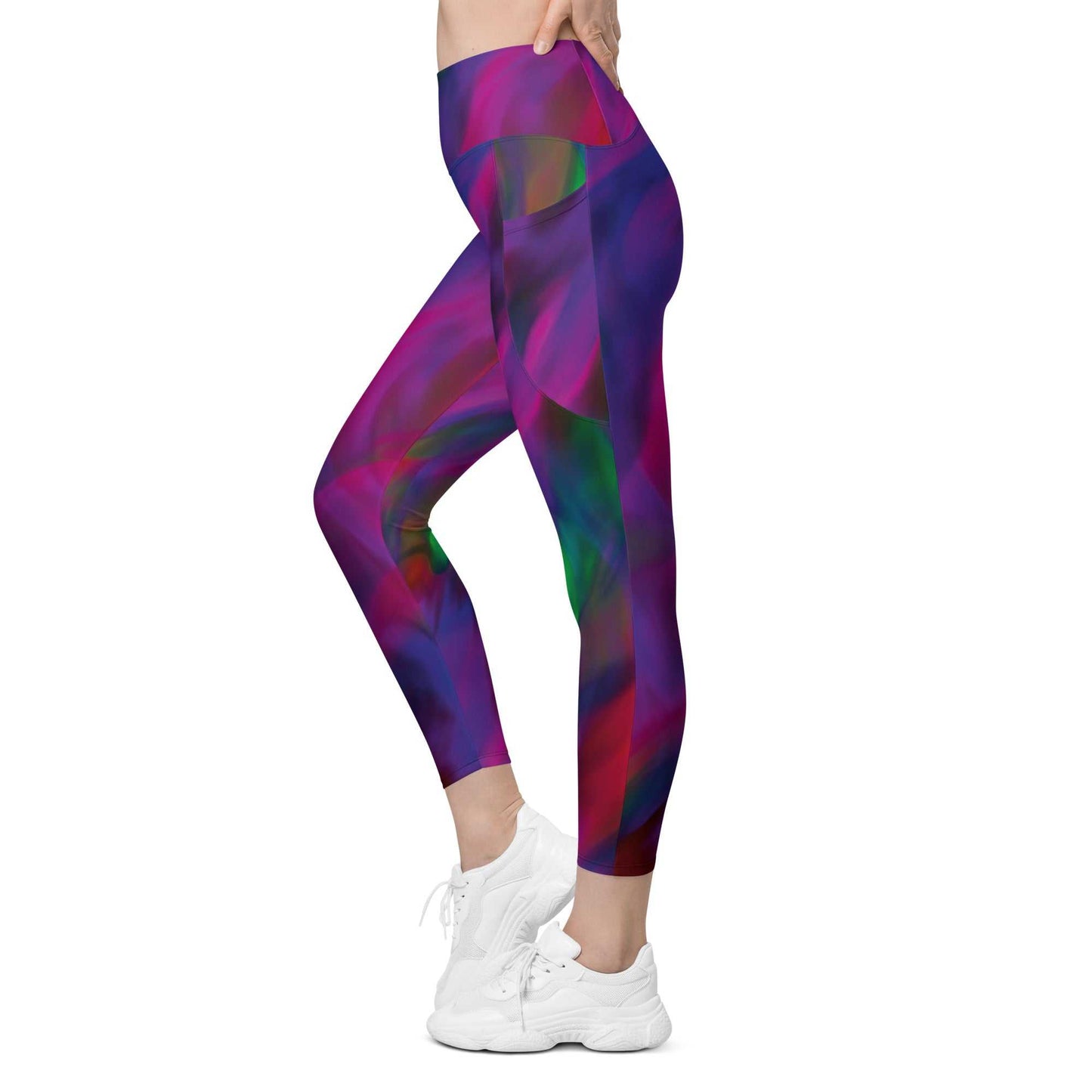 A model wearing The Bologna Sculpt Leggings, showing the high-waisted fit and the vibrant purple, pink, and green graphic print.