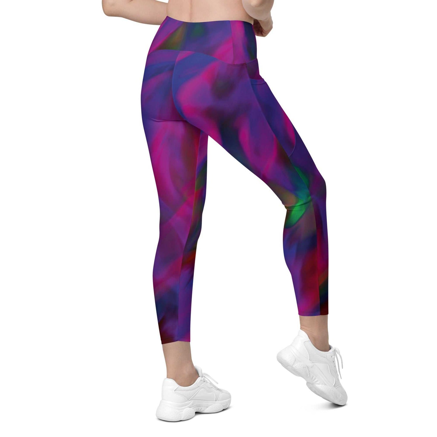 A model wearing The Bologna Sculpt Leggings, showing the high-waisted fit and the vibrant purple, pink, and green graphic print.