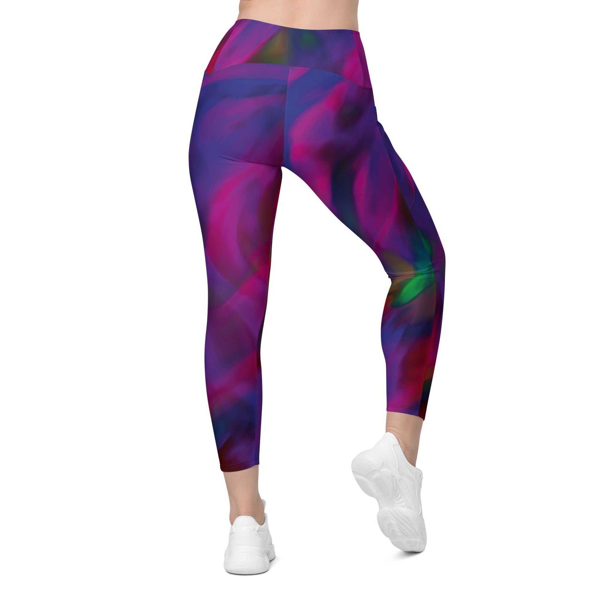 A model wearing The Bologna Sculpt Leggings, showing the high-waisted fit and the vibrant purple, pink, and green graphic print.