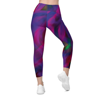 A model wearing The Bologna Sculpt Leggings, showing the high-waisted fit and the vibrant purple, pink, and green graphic print.