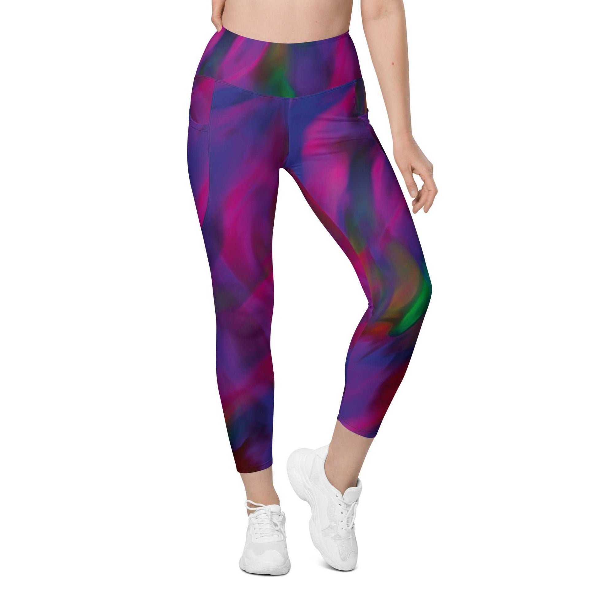 A model wearing The Bologna Sculpt Leggings, showing the high-waisted fit and the vibrant purple, pink, and green graphic print.