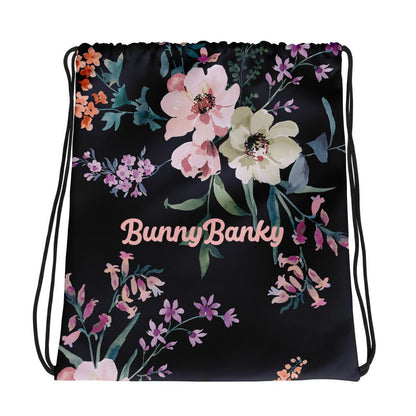 the kew botanical bag featuring a  floral print on navy blue fabric.