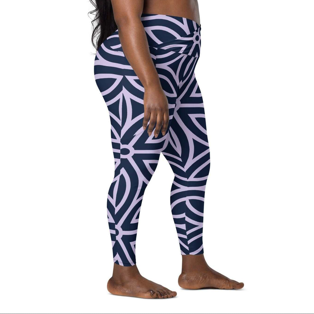 model wearing the Canary Wharf  Sculpt Crossover  Leggings in blue and lilac geometric floral pattern