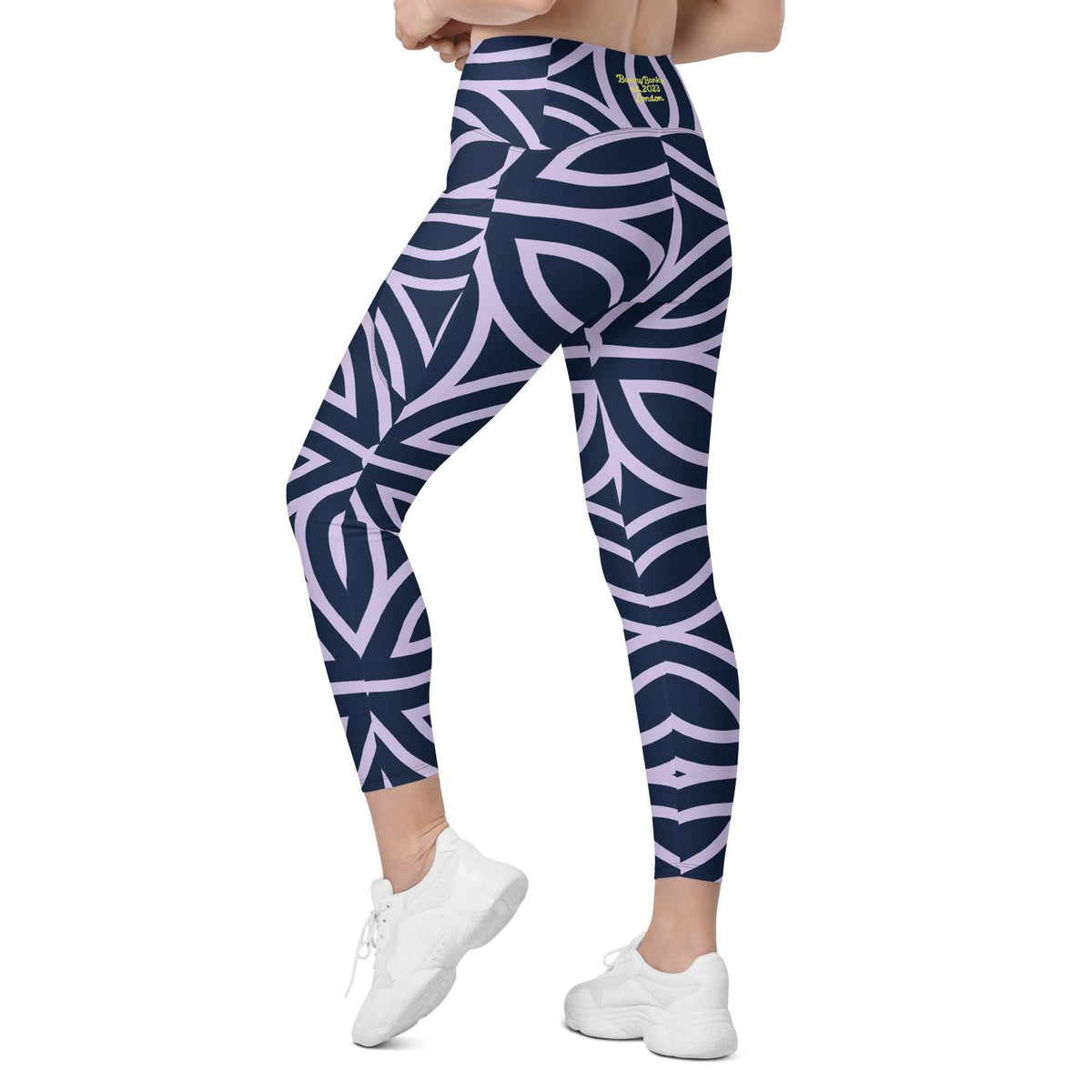 model wearing the Canary Wharf  Sculpt Crossover  Leggings in blue and lilac geometric floral pattern