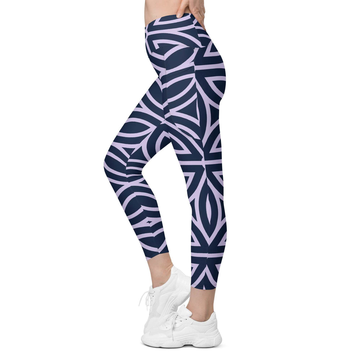 model wearing the Canary Wharf  Sculpt Crossover  Leggings in blue and lilac geometric floral pattern