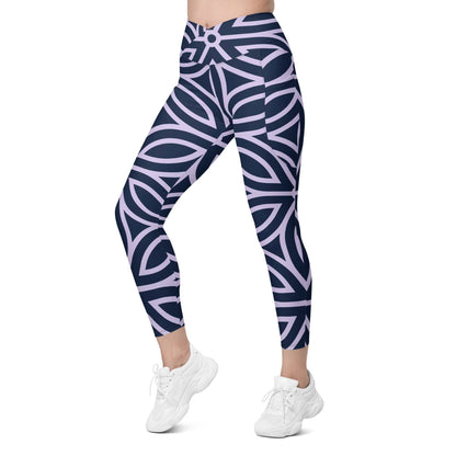 model wearing the Canary Wharf  Sculpt Crossover  Leggings in blue and lilac geometric floral pattern