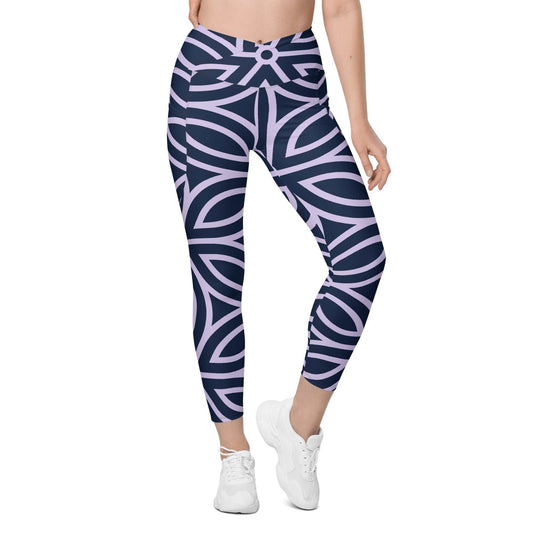 model wearing the Canary Wharf  Sculpt Crossover  Leggings in blue and lilac geometric floral pattern