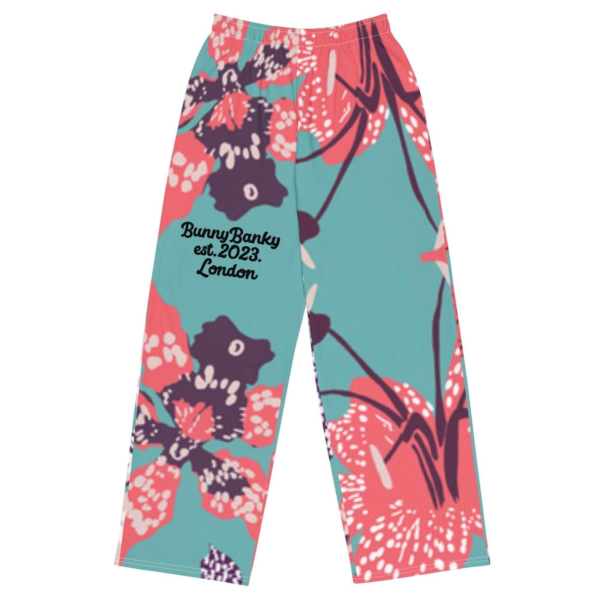 The Chelsea Flow Joggers featuring  a tropical print and  heritage logo against a white background.