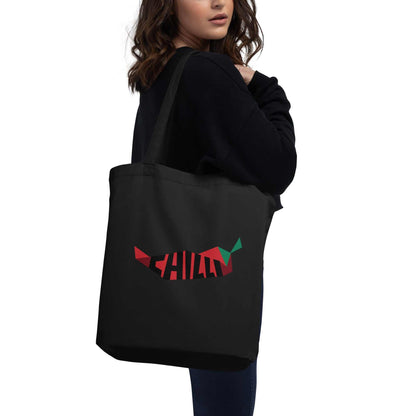 A model holding The Chilly Tote featuring a large red chili pepper and "Chilly" text on both sides.